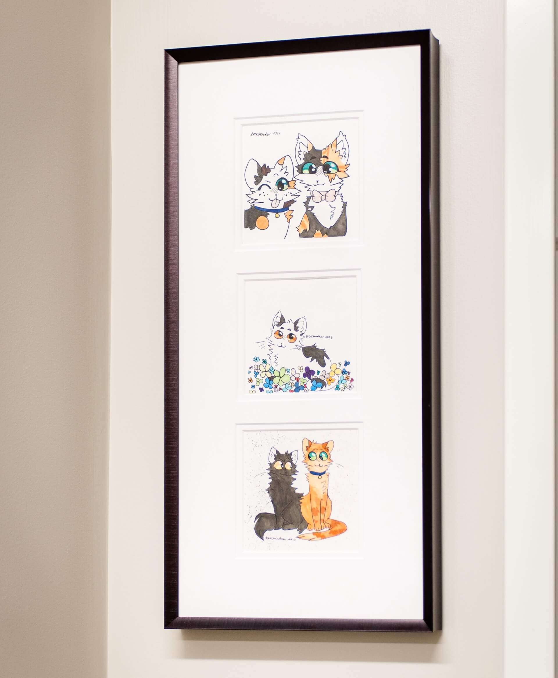 A framed picture of cats